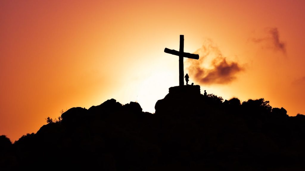 pexels-photo-415571 Human Standing Beside Crucifix Statue on Mountain